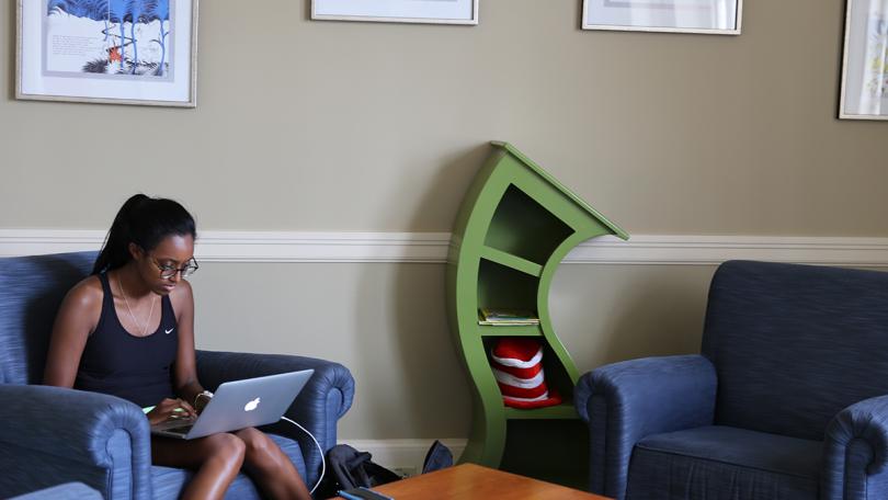 Student studies in Dr. Seuss room in Baker-Berry Library