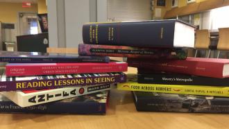 Pile of newly published books by Dartmouth authors
