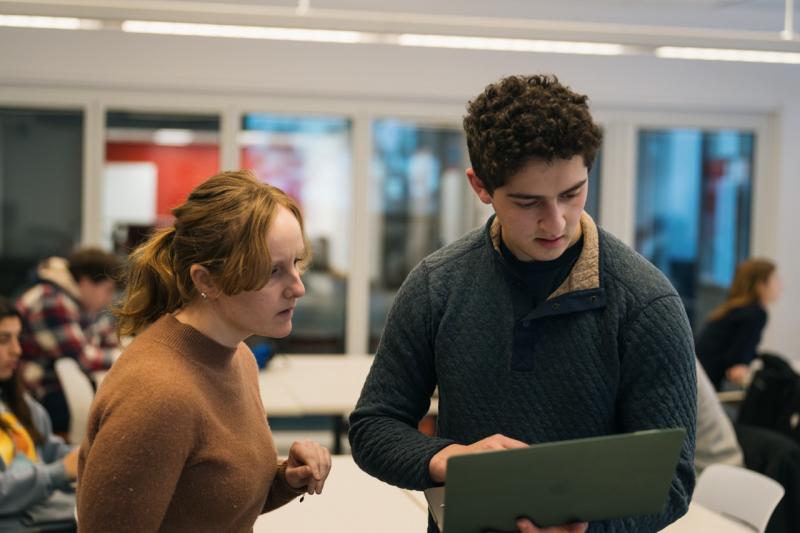 Liz Shand helps a student while teaching in The LINK