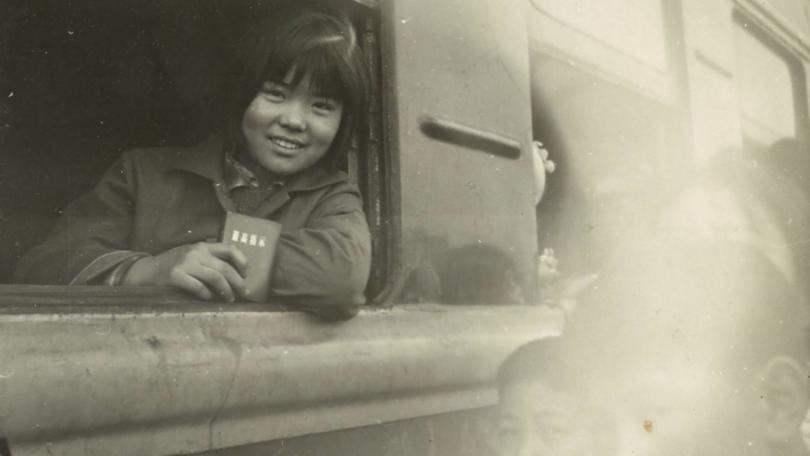 image of a girl riding a train in Shanghai in 1970