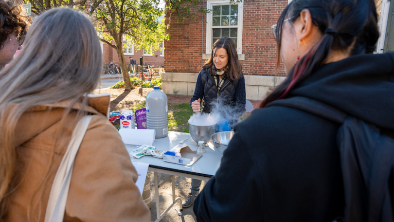 Students watch on as a Chemistry Department member makes ice cream with liquid nitrogen