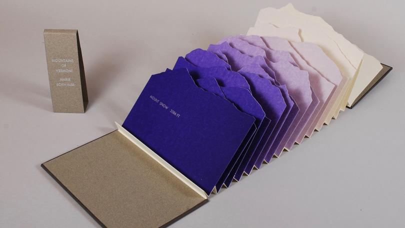 artist book with series of purple mountains