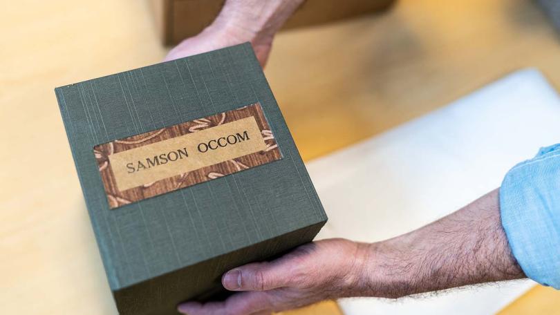 Peter Carini, College Archivist holds Occom papers presentation box.