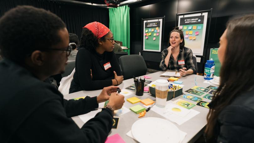 Workshop participants at thinking together at a table