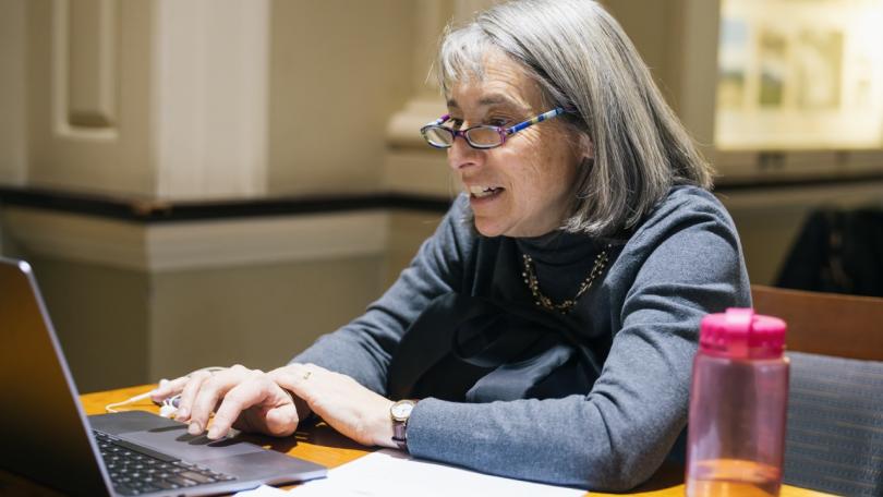 person working in Reiss Hall on their laptop