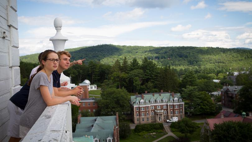 People look out over Dartmouth campus from the Baker-Berry tower