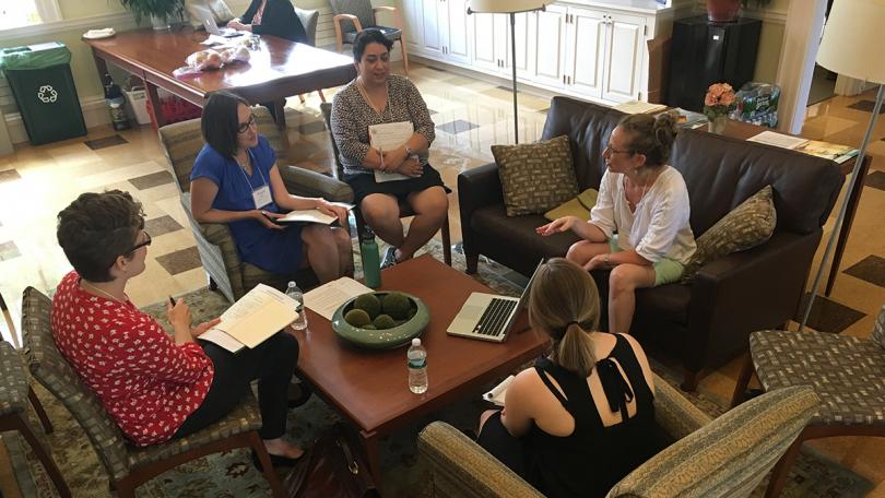 Librarians talking in a circle