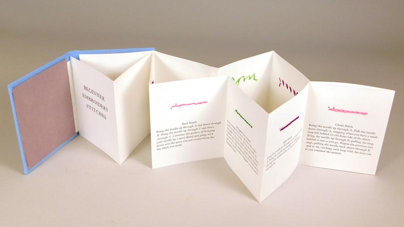 accordion book with letterpress text and embroidered diagrams