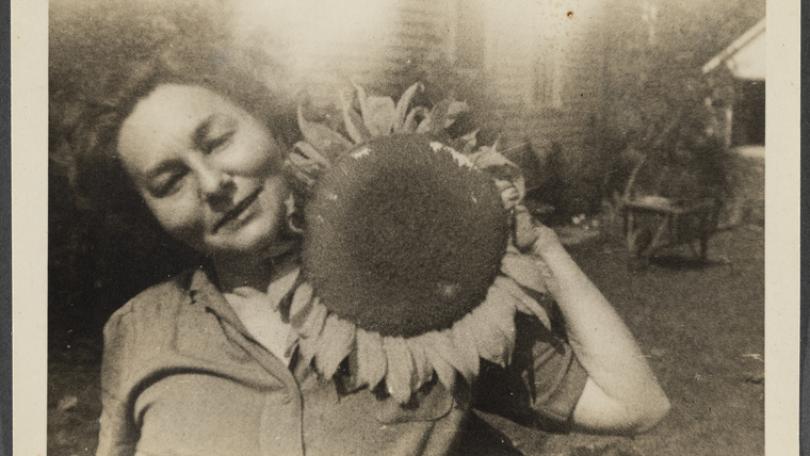 image of Genevieve Taggard with a sunflower