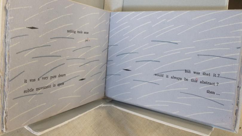 Open book with textured pages and text