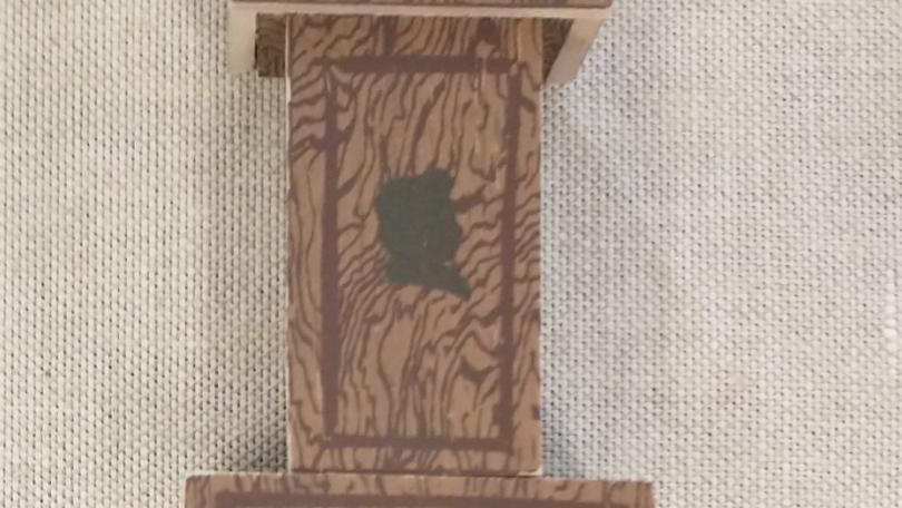 Tiny book in the shape of a clock