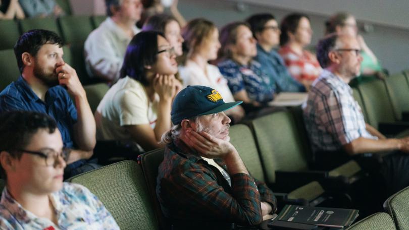 photo depicts Advancing Pathways audience listening to a guest speaker