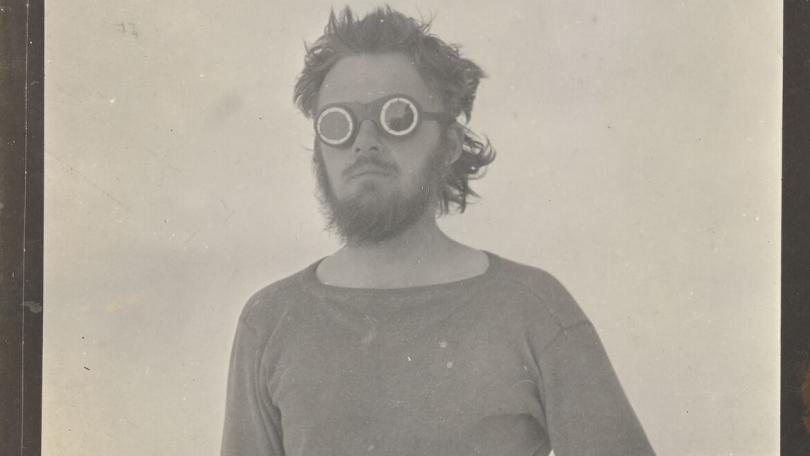 black and white photo of E Lorne Knight on Wrangel Island wearing goggles