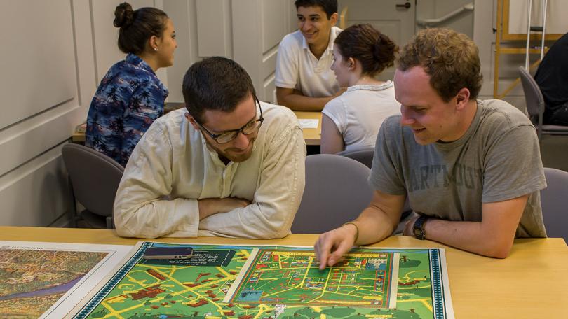 Two students looking at a map together