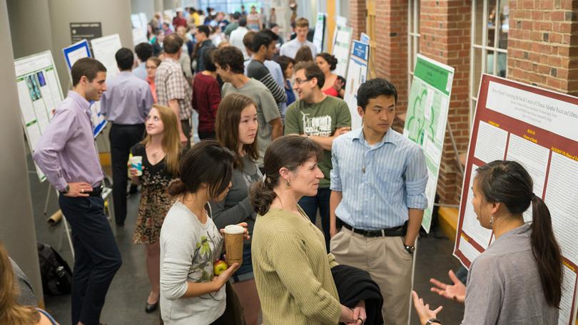 Students giving presentations in front of panels