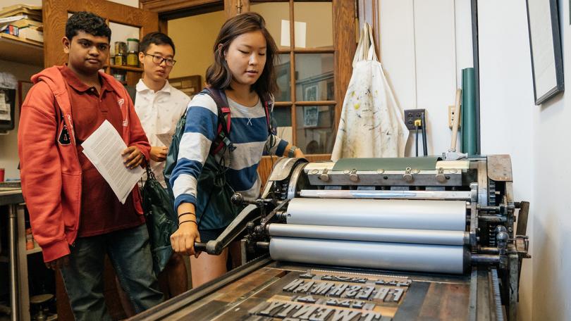 Students printing on Vandercook press