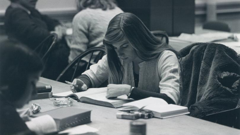 Woman studying with cigarette