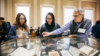 Jay Satterfield with students in Baker Library