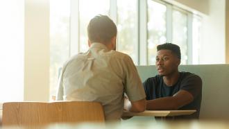 Students meet at table
