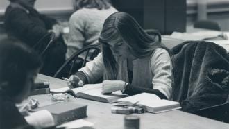 Woman studying with cigarette