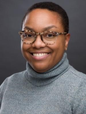 woman smiling with glasses