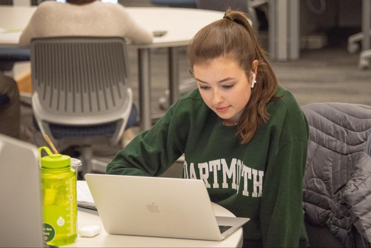 Dartmouth student studying in the library