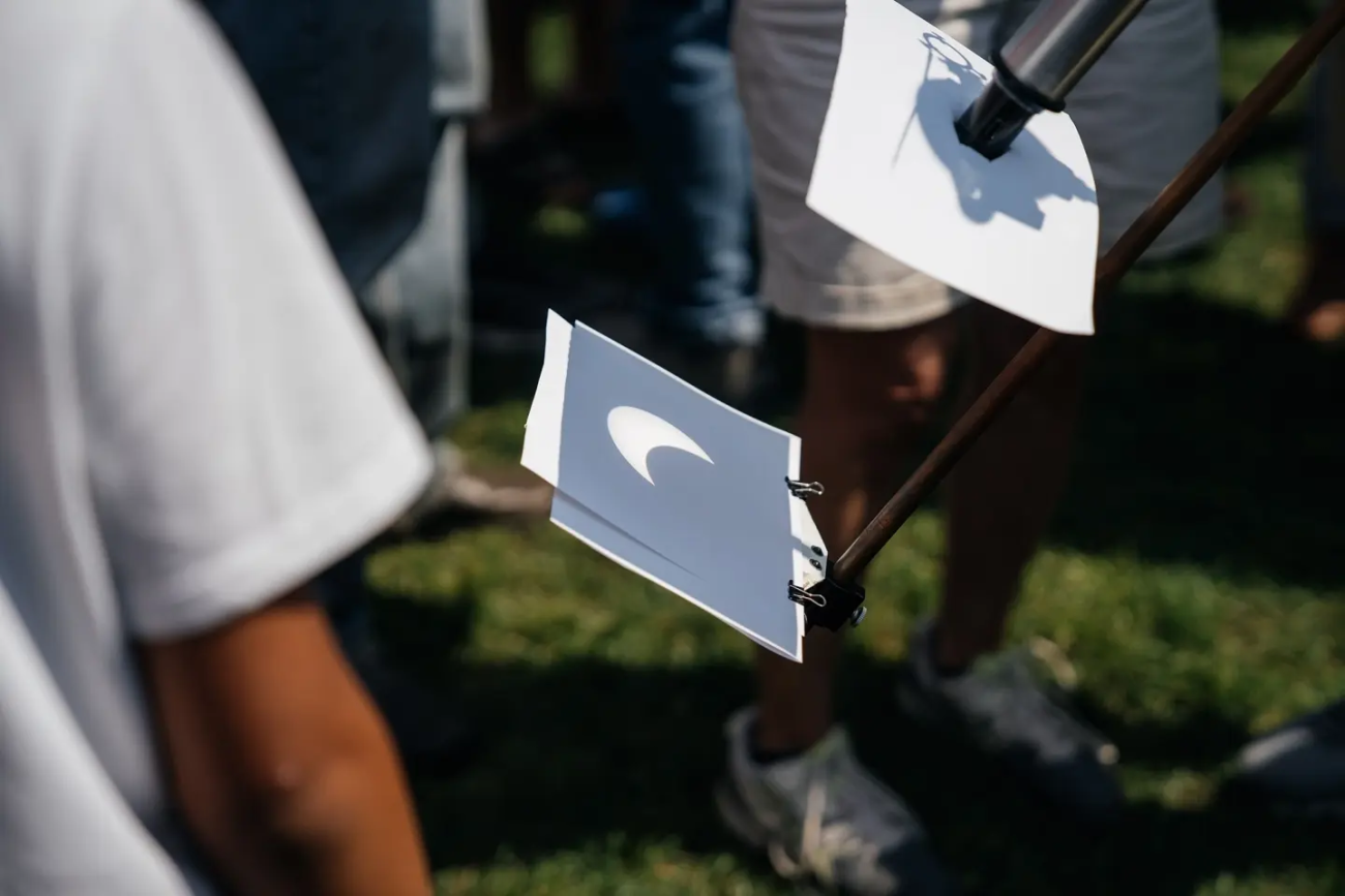 students view an eclipse on the Green