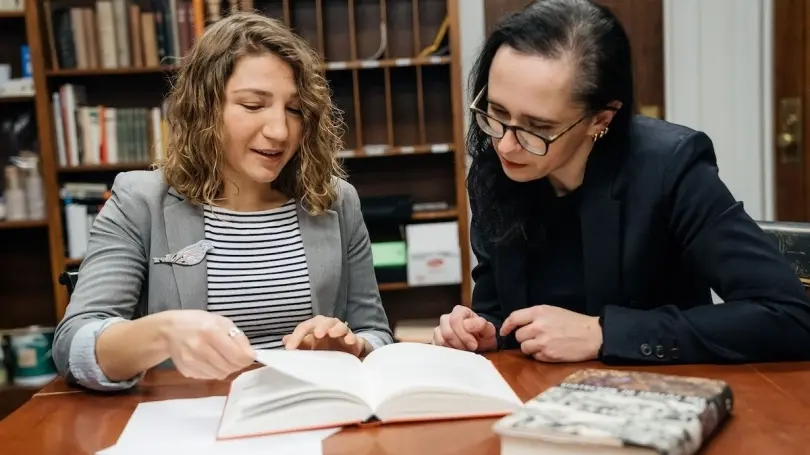 German studies professor Yuliya Komska, right, works with Tetiana Savchynska, Guarini ’18, who has translated numerous English texts into Ukrainian under contract with the Old Lion Publishing House, one of the biggest Ukrainian publishers.