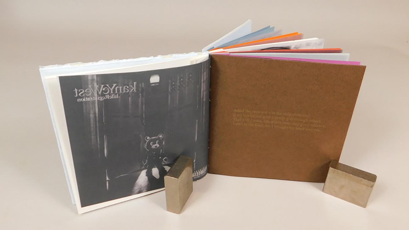 Artist book of of Kanye West images and lyrics on translucent and brown pages