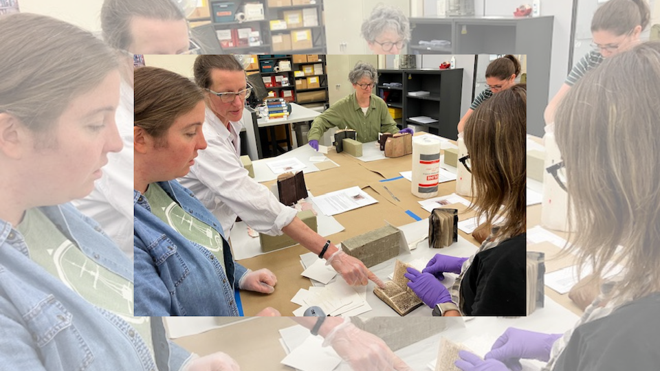 attendees restore frozen books in workshops hosted by the Libraries Preservation Team