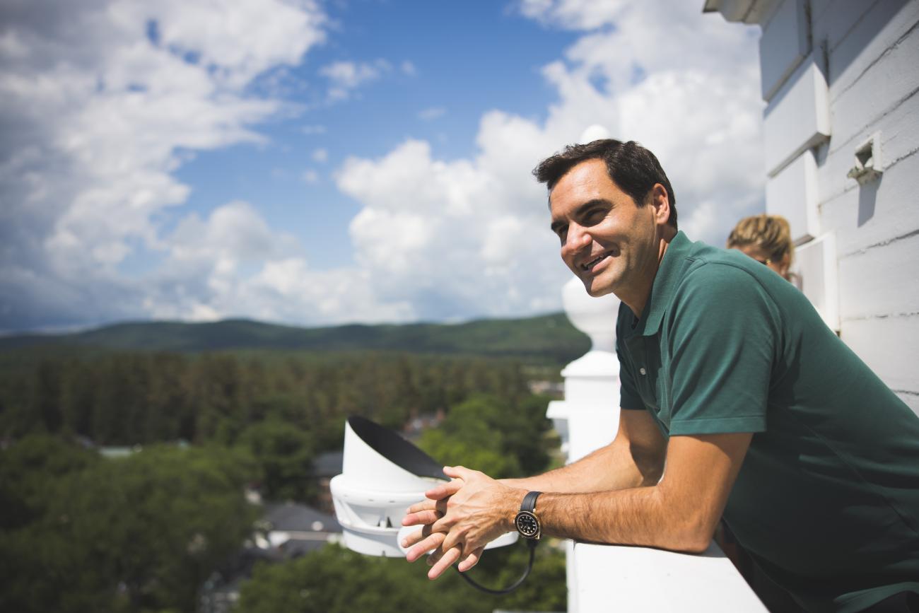 Roger Federer smiles as he looks across the valley atop Baker Bell Tower