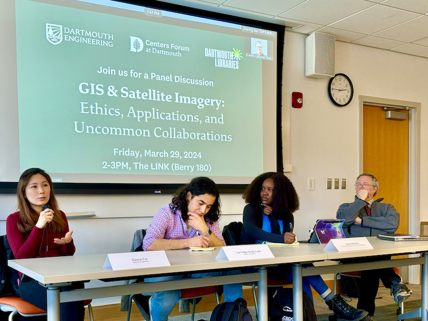four speakers sit at a table as part of Uncommon Collaborations panel