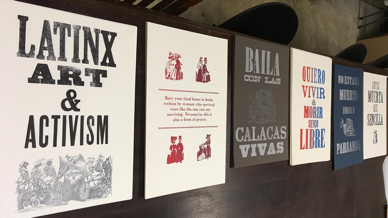 a number of posters with large type about Latinx Art and Activism