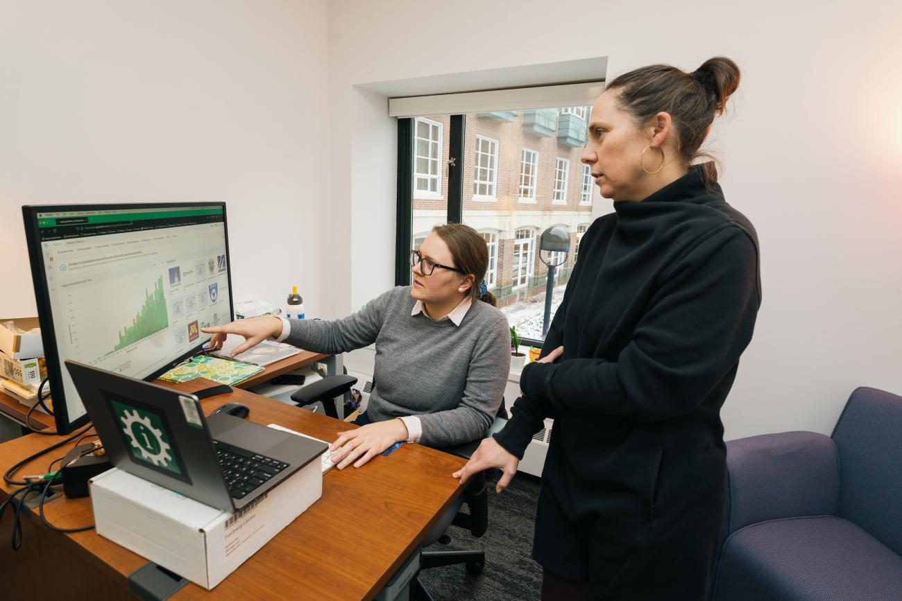 Feldberg Library librarians Jentry Campbell left and Amelia Looby right look at a computer screen display Patent Lens information