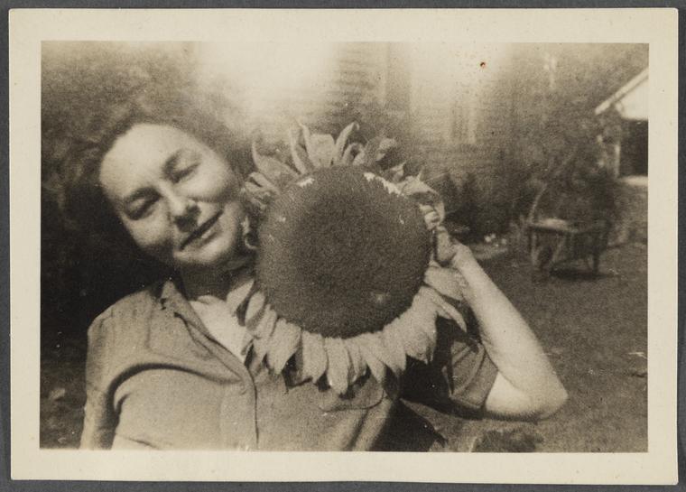 image of Genevieve Taggard with a sunflower