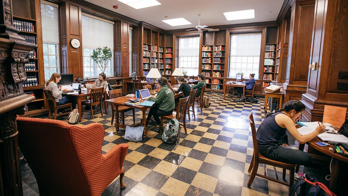 A wide view of a room with students studying 