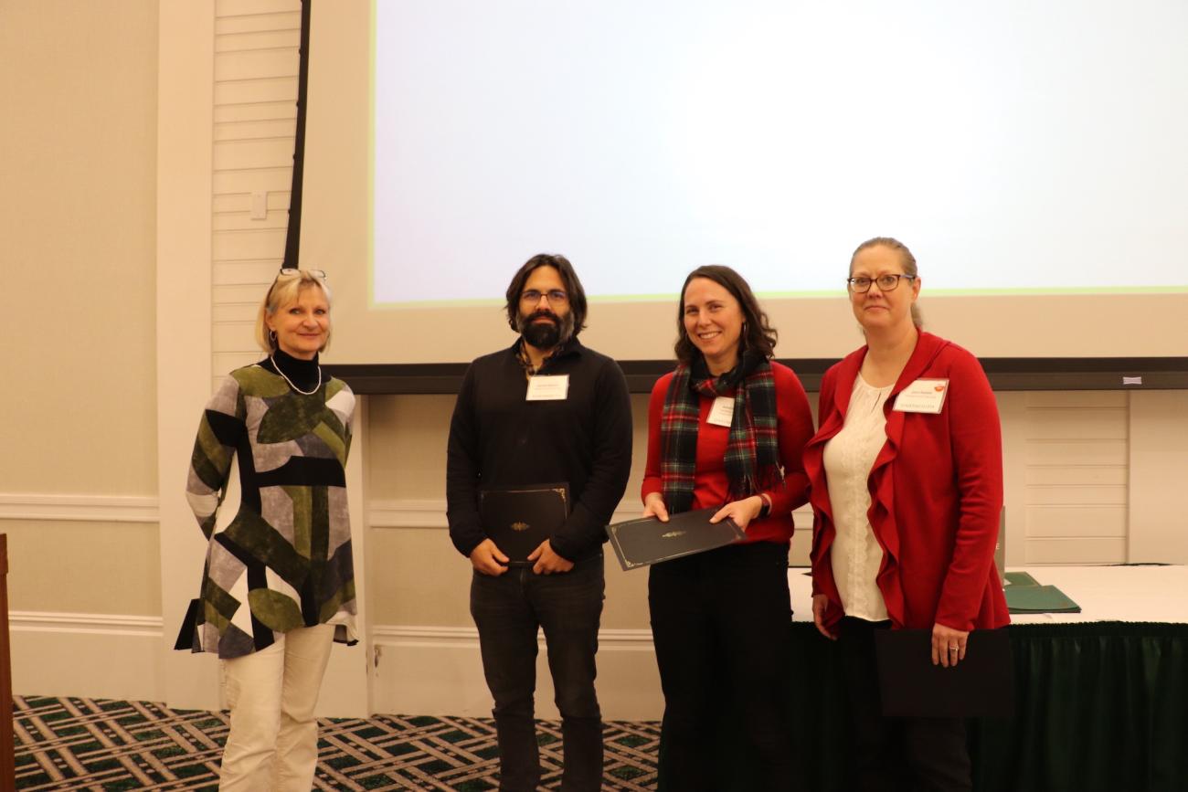 Springshare team posing with Sue Mehrer at 2022 holiday party awards ceremony