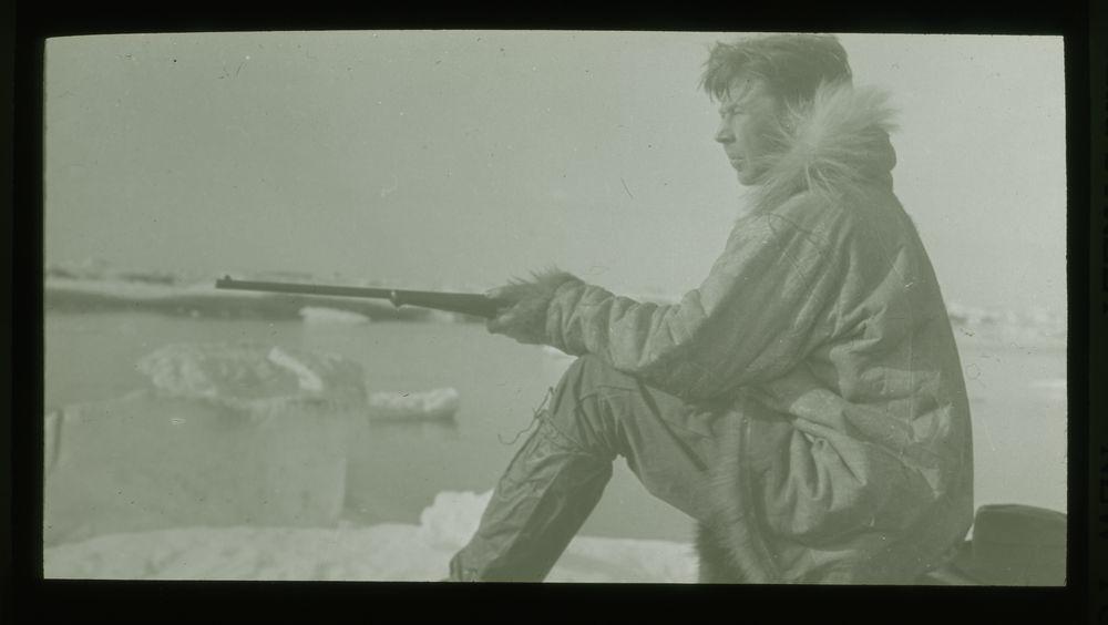 Harold Noice holding a rifle, 1923 Wrangel Island rescue mission