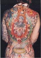 A human back covered in colorful tattoos
