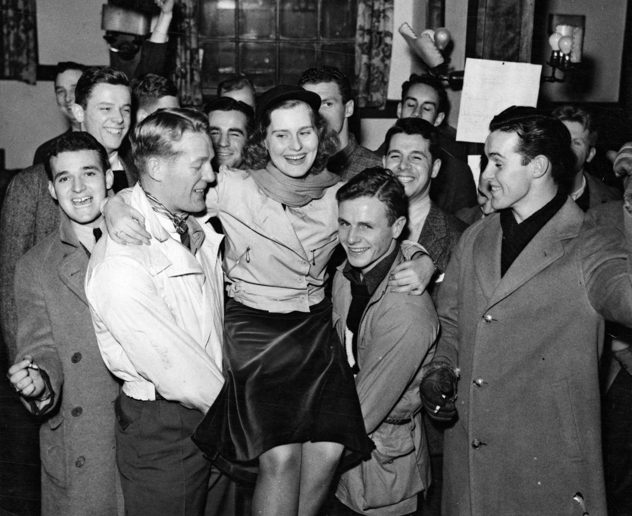 "Queen of the Snows" Dorothy Gardner, held aloft by her subjects.
