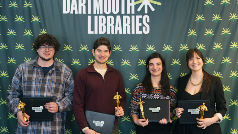 four people smile at the camera at the Dartmouth OSCARRs