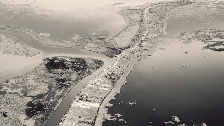 Aerial black and white photo of land and water