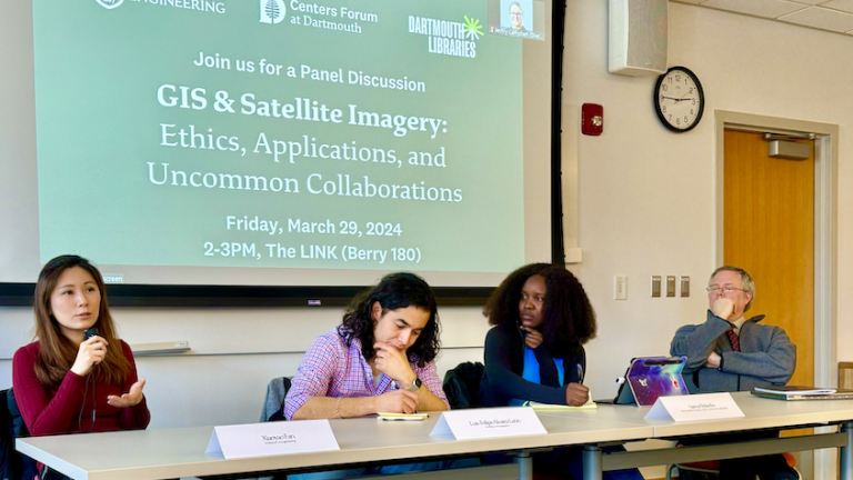 four speakers sit at a table as part of Uncommon Collaborations panel
