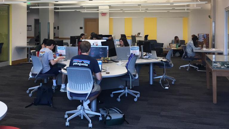 Students sit at work stations in the Jones Media Center of the Dartmouth Library