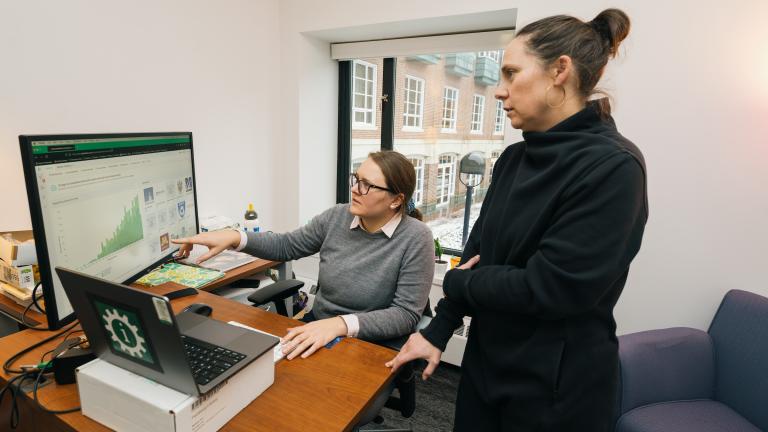 Feldberg Library librarians Jentry Campbell left and Amelia Looby right look at a computer screen display Patent Lens information