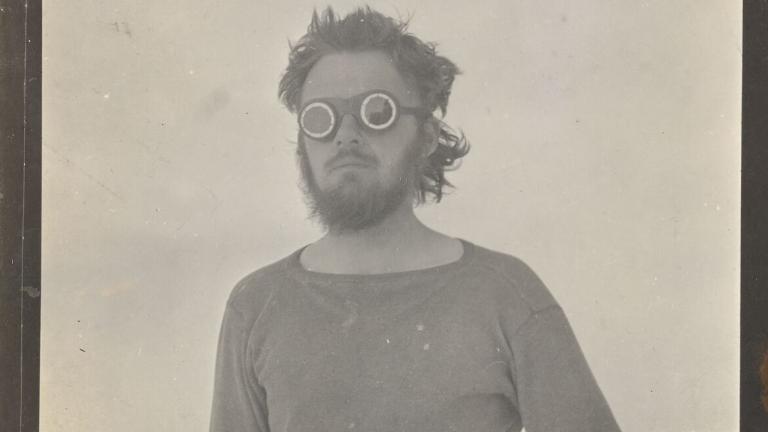black and white photo of E Lorne Knight on Wrangel Island wearing goggles
